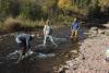 Researchers collect samples of rock snot on the Devil Track River in Oct 2021. Photo by Joe Friedrichs